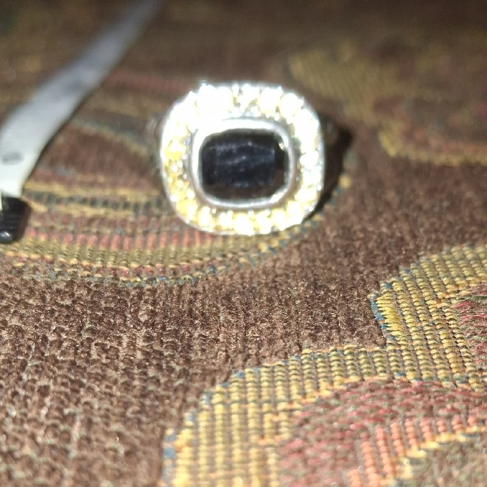 Elegant Silver and Black Ring with Gold Accents